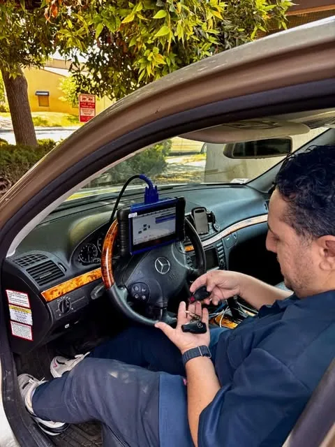 Adam programming a new Mercedes-Benz key inside the car